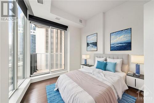 This photo has been virtually staged. - 40 Nepean Street Unit#1003, Ottawa, ON - Indoor Photo Showing Bedroom