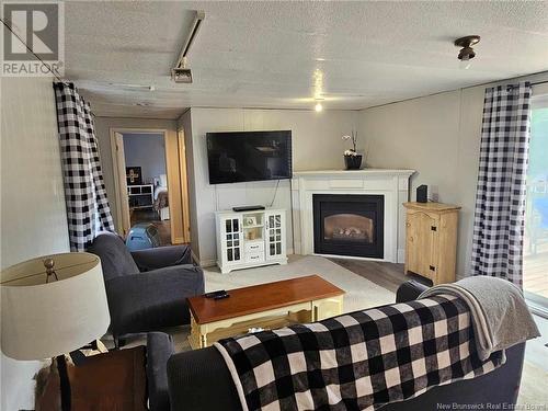 144 Principale, Pointe-Verte, NB - Indoor Photo Showing Living Room With Fireplace