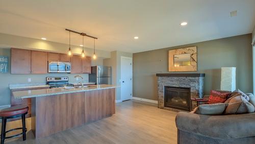 1257 Feedham Avenue, Kelowna, BC - Indoor Photo Showing Other Room With Fireplace