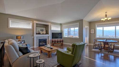 1257 Feedham Avenue, Kelowna, BC - Indoor Photo Showing Other Room With Fireplace