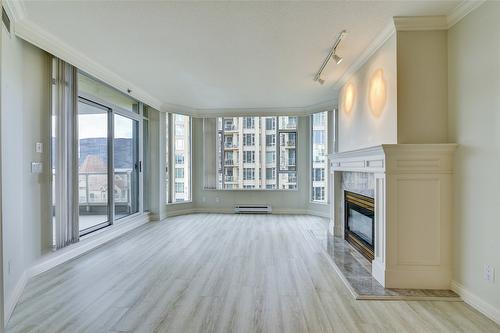 606-1152 Sunset Drive, Kelowna, BC - Indoor With Fireplace