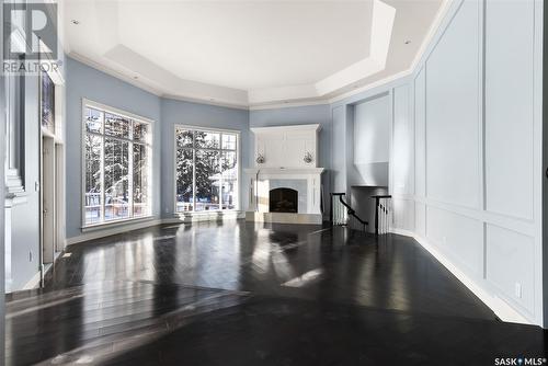 27 Federal Drive, White City, SK - Indoor Photo Showing Living Room With Fireplace