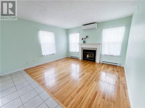 64 Mcandrew Street, Moncton, NB - Indoor Photo Showing Living Room With Fireplace