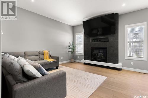 4522 Green Brooks Way E, Regina, SK - Indoor Photo Showing Living Room With Fireplace