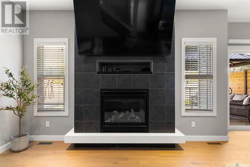 4522 Green Brooks Way E, Regina, SK - Indoor Photo Showing Living Room With Fireplace