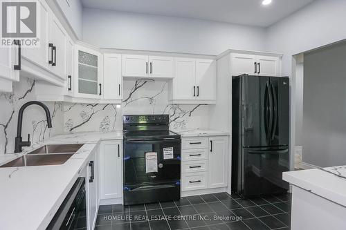 117 - 8111 Forest Glen Drive, Niagara Falls, ON - Indoor Photo Showing Kitchen With Double Sink