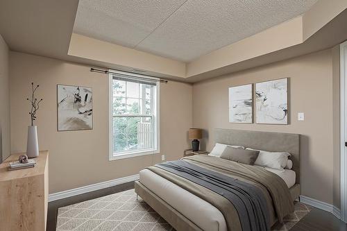 Virtually Staged Primary Bedroom - 4003 Kilmer Drive Unit# 309, Burlington, ON - Indoor Photo Showing Bedroom