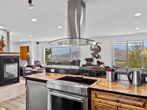 5657 Beaton Road, Kamloops, BC - Indoor Photo Showing Kitchen With Fireplace