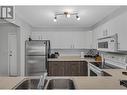 400 Sutton Crescent Unit# 103, Kelowna, BC  - Indoor Photo Showing Kitchen With Double Sink 