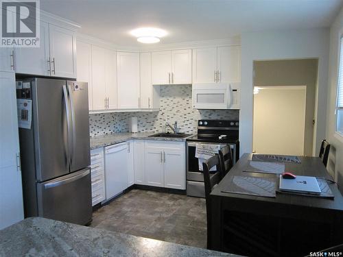 1107 Centre Street, Nipawin, SK - Indoor Photo Showing Kitchen With Double Sink