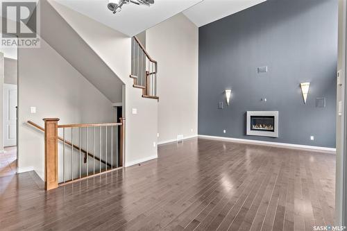 65 602 Cartwright Street, Saskatoon, SK - Indoor Photo Showing Other Room With Fireplace