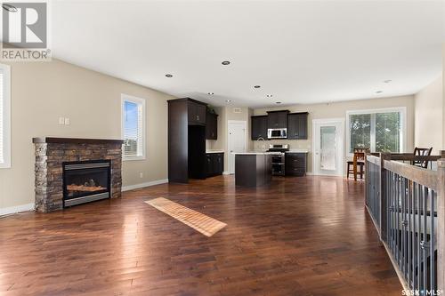 15 Stardust Bay, White City, SK - Indoor Photo Showing Living Room With Fireplace