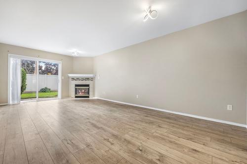 6-1120 Guisachan Road, Kelowna, BC - Indoor Photo Showing Other Room With Fireplace