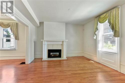 Living Room with Gas Fireplace - 22 James Street E, Brockville, ON - Indoor With Fireplace