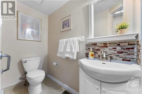 Main floor powder room located just off the front entry. - 17 Sovereign Avenue, Ottawa, ON - Indoor Photo Showing Bathroom