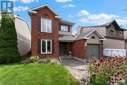 Inviting brick walkway with perennial gardens provides great curb appeal. - 