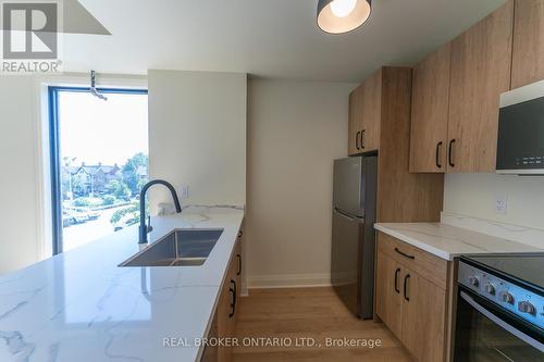 506 - 11 Robert Street, Hamilton (Beasley), ON - Indoor Photo Showing Kitchen With Double Sink