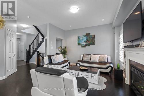 11 - 7 Atessa Drive, Hamilton, ON - Indoor Photo Showing Living Room With Fireplace