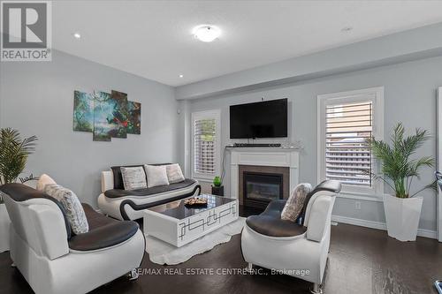 11 - 7 Atessa Drive, Hamilton (Ryckmans), ON - Indoor Photo Showing Living Room With Fireplace