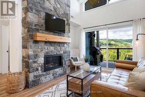 406 - 16 Beckwith Lane W, Blue Mountains, ON - Indoor Photo Showing Living Room With Fireplace