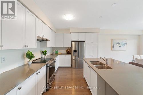 59 Fairey Crescent W, Hamilton (Mount Hope), ON - Indoor Photo Showing Kitchen With Stainless Steel Kitchen With Double Sink With Upgraded Kitchen