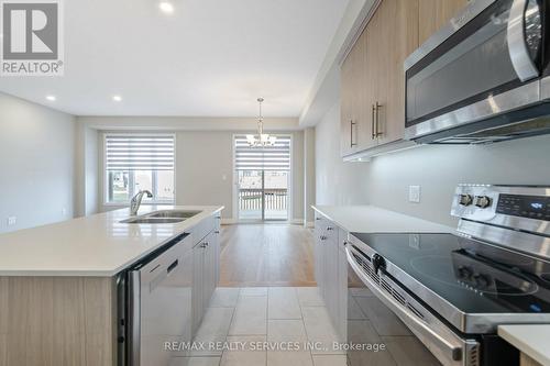 713 Chelton Road, London, ON - Indoor Photo Showing Kitchen With Stainless Steel Kitchen With Double Sink With Upgraded Kitchen