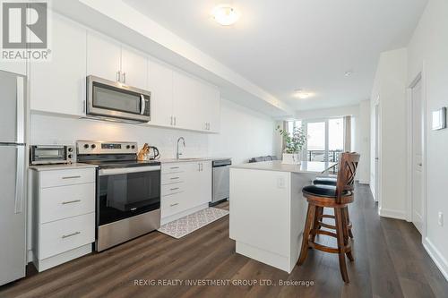 615 - 3200 William Coltson Avenue, Oakville, ON - Indoor Photo Showing Kitchen With Stainless Steel Kitchen With Upgraded Kitchen