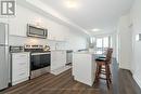 615 - 3200 William Coltson Avenue, Oakville, ON  - Indoor Photo Showing Kitchen With Stainless Steel Kitchen With Upgraded Kitchen 