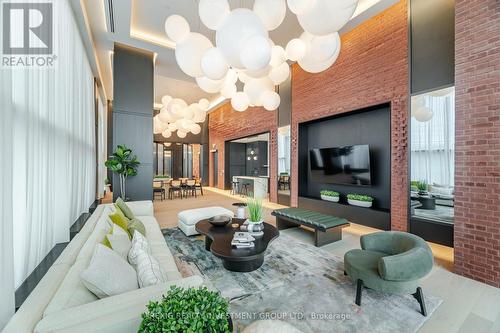 615 - 3200 William Coltson Avenue, Oakville, ON - Indoor Photo Showing Living Room With Fireplace