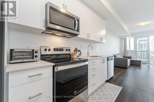 615 - 3200 William Coltson Avenue, Oakville, ON - Indoor Photo Showing Kitchen With Stainless Steel Kitchen With Upgraded Kitchen