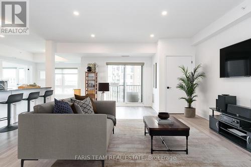 211 - 8 Culinary Lane, Barrie (Innis-Shore), ON - Indoor Photo Showing Living Room