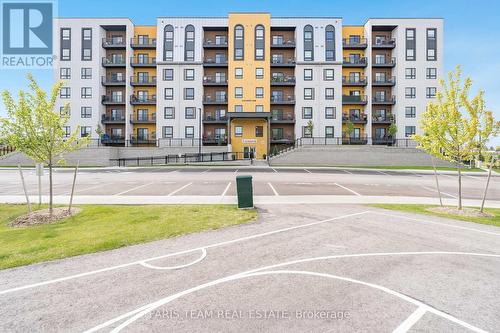 211 - 8 Culinary Lane, Barrie (Innis-Shore), ON - Outdoor With Balcony With Facade