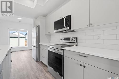 203 Cowessess Road, Saskatoon, SK - Indoor Photo Showing Kitchen With Stainless Steel Kitchen With Upgraded Kitchen