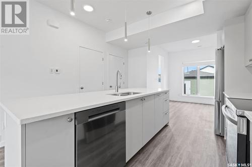 203 Cowessess Road, Saskatoon, SK - Indoor Photo Showing Kitchen With Double Sink