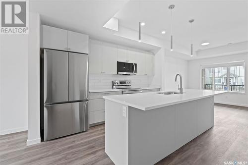 203 Cowessess Road, Saskatoon, SK - Indoor Photo Showing Kitchen With Stainless Steel Kitchen With Upgraded Kitchen