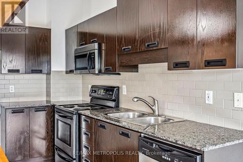 302 - 2 Fieldway Road, Toronto (Islington-City Centre West), ON - Indoor Photo Showing Kitchen With Stainless Steel Kitchen With Double Sink With Upgraded Kitchen