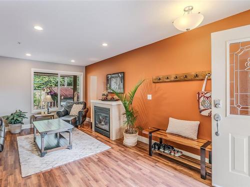 102-3776 Departure Bay Rd, Nanaimo, BC - Indoor Photo Showing Living Room With Fireplace