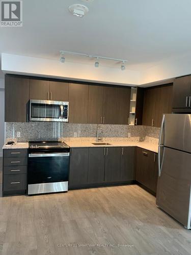 217 - 2550 Simcoe Street N, Oshawa (Windfields), ON - Indoor Photo Showing Kitchen With Stainless Steel Kitchen With Upgraded Kitchen