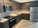 217 - 2550 Simcoe Street N, Oshawa (Windfields), ON  - Indoor Photo Showing Kitchen With Stainless Steel Kitchen With Upgraded Kitchen 