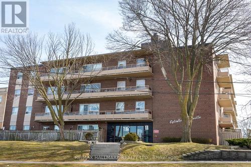 203 - 71 Jonesville Crescent, Toronto (Victoria Village), ON - Outdoor With Balcony With Facade