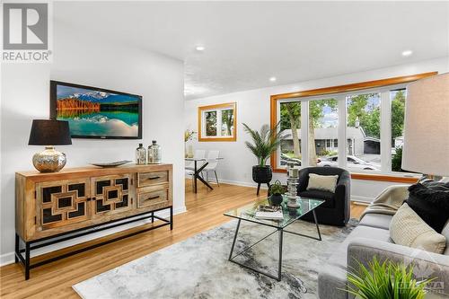 Spacious living room with abundant natural light, perfect for relaxing or entertaining. - 1155 Minnetonka Road, Ottawa, ON - Indoor Photo Showing Living Room