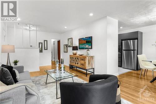 Spacious living room with abundant natural light, perfect for relaxing or entertaining. - 1155 Minnetonka Road, Ottawa, ON - Indoor Photo Showing Living Room