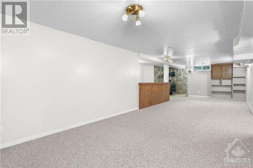 Spacious basement recreation room, perfect for relaxation and entertainment. - 1155 Minnetonka Road, Ottawa, ON - Indoor Photo Showing Other Room