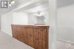 Spacious basement recreation room, perfect for relaxation and entertainment. - 