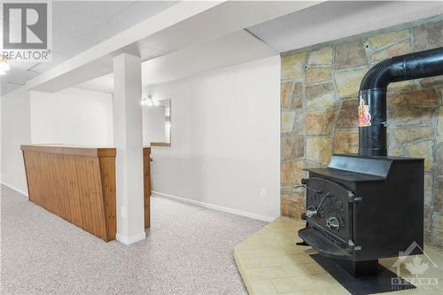 Cozy wood stove in the basement for warmth and charm. - 1155 Minnetonka Road, Ottawa, ON - Indoor Photo Showing Other Room