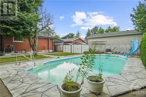 Enjoy endless summer days with a refreshing outdoor pool in your private backyard oasis. - 1155 Minnetonka Road, Ottawa, ON - Outdoor With In Ground Pool With Backyard