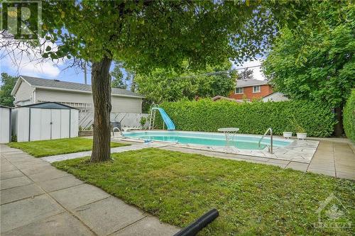 Spacious backyard perfect for outdoor gatherings and relaxation. - 1155 Minnetonka Road, Ottawa, ON - Outdoor With In Ground Pool With Backyard