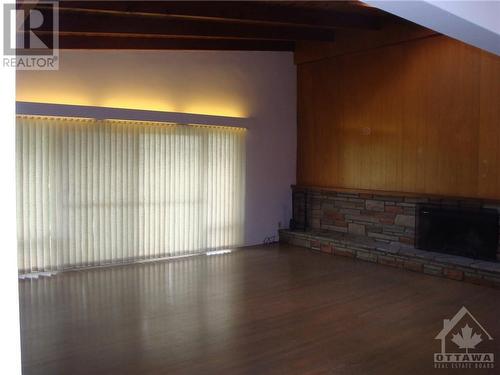 Large living room - 628 Thessaly Circle, Ottawa, ON - Indoor Photo Showing Other Room With Fireplace