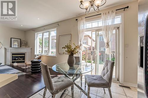 64 Lakespring Drive, Markham (Cachet), ON - Indoor Photo Showing Dining Room With Fireplace