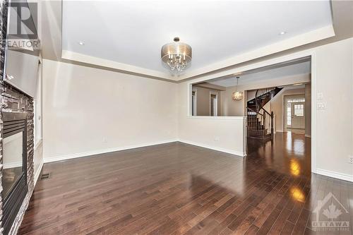 Living Room looking towards Dining Room and Foyer - 231 Des Soldats-Riendeau Street, Ottawa, ON - Indoor Photo Showing Other Room With Fireplace